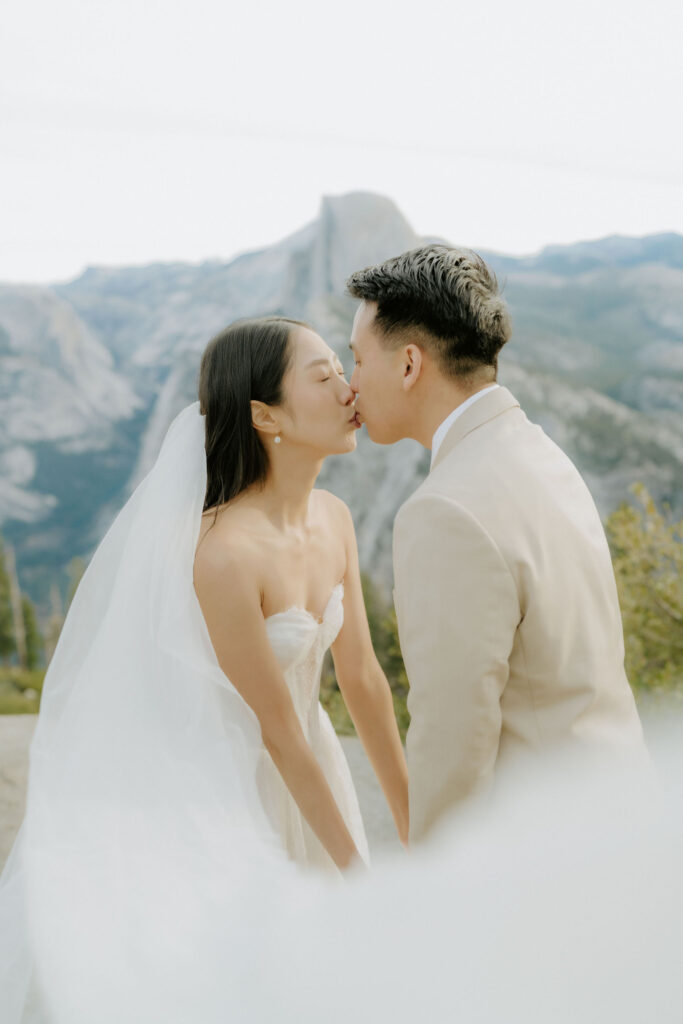 cute picture of the newlyweds kissing