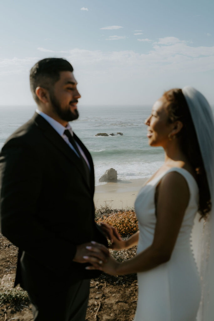 cute picture of the newlyweds smiling at each other