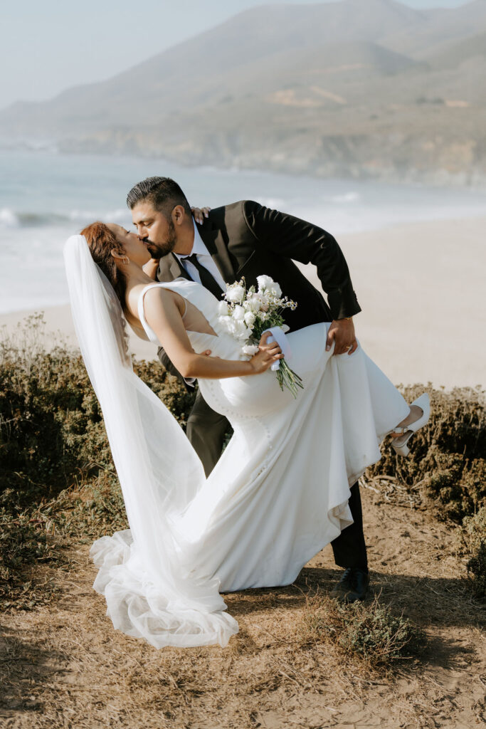 cute portrait of the newlyweds kissing