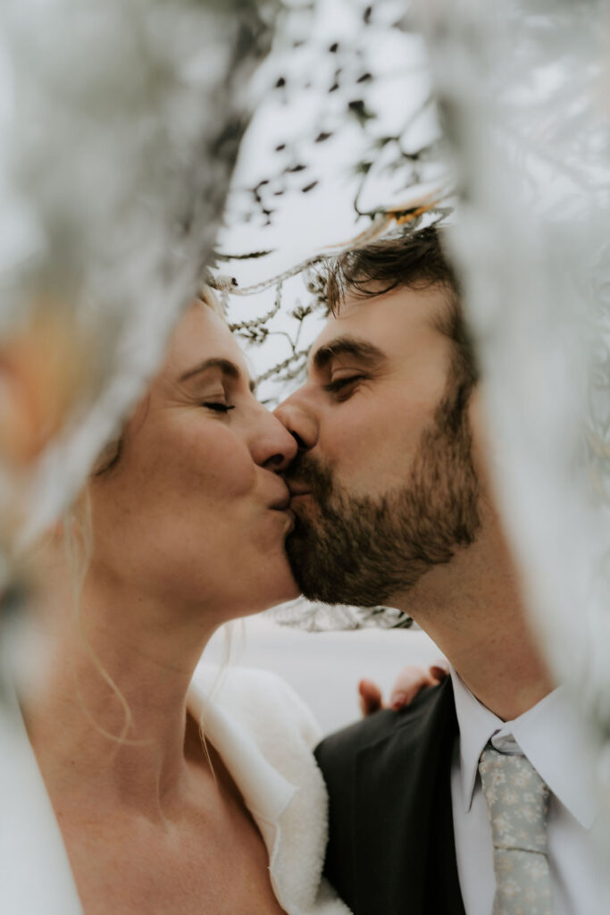cute picture of the newlyweds kissing