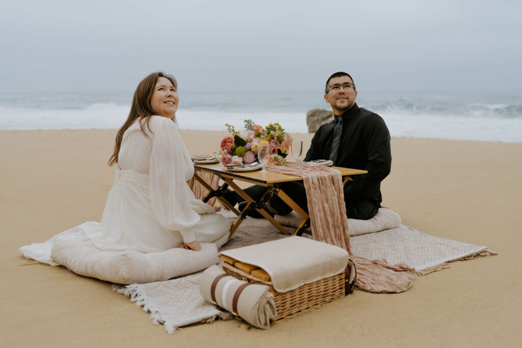 couple celebrating their elopement with a picnic