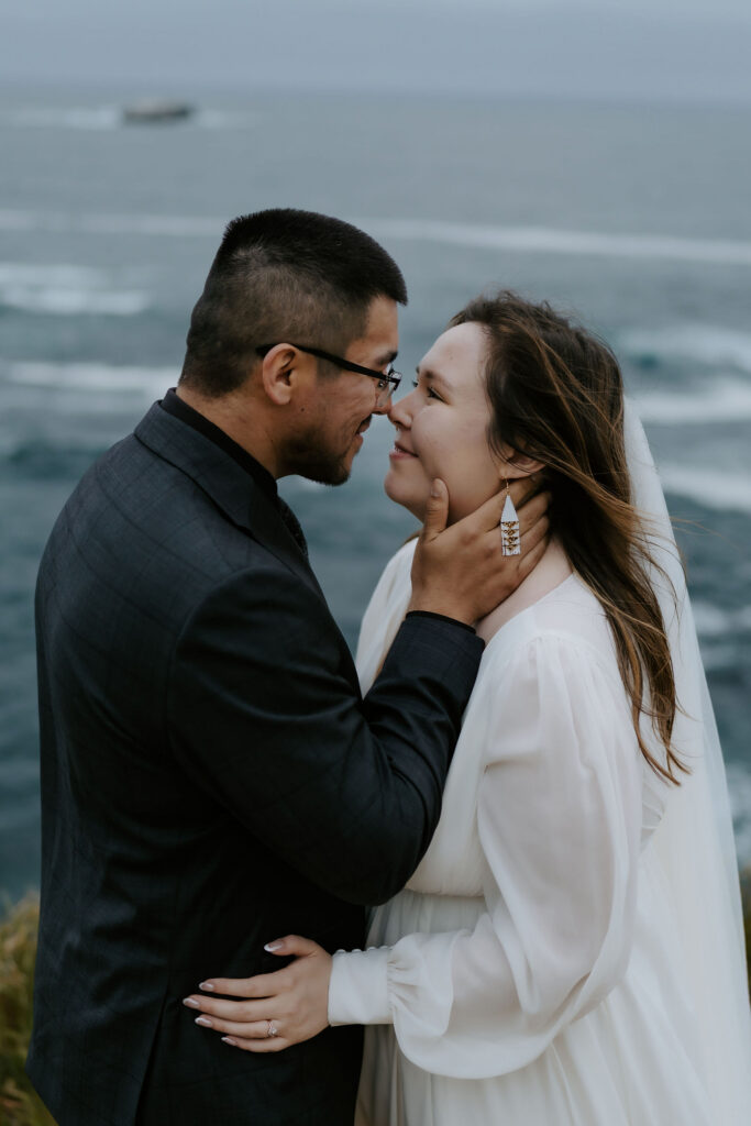 bride and groom smiling at each other during their bridal photos