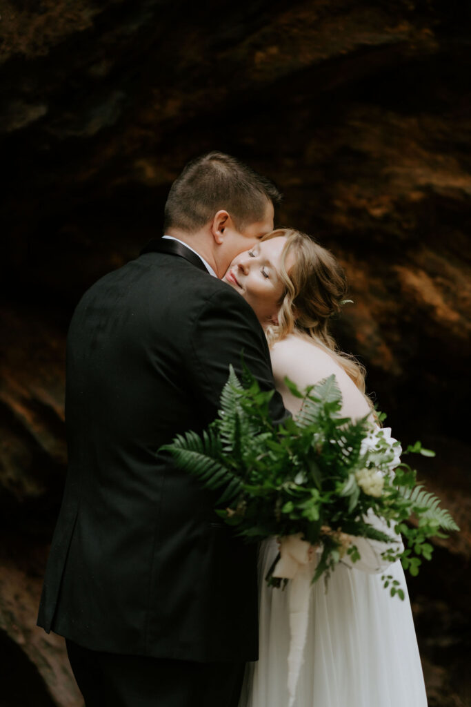 bride and groom hugging after their first look