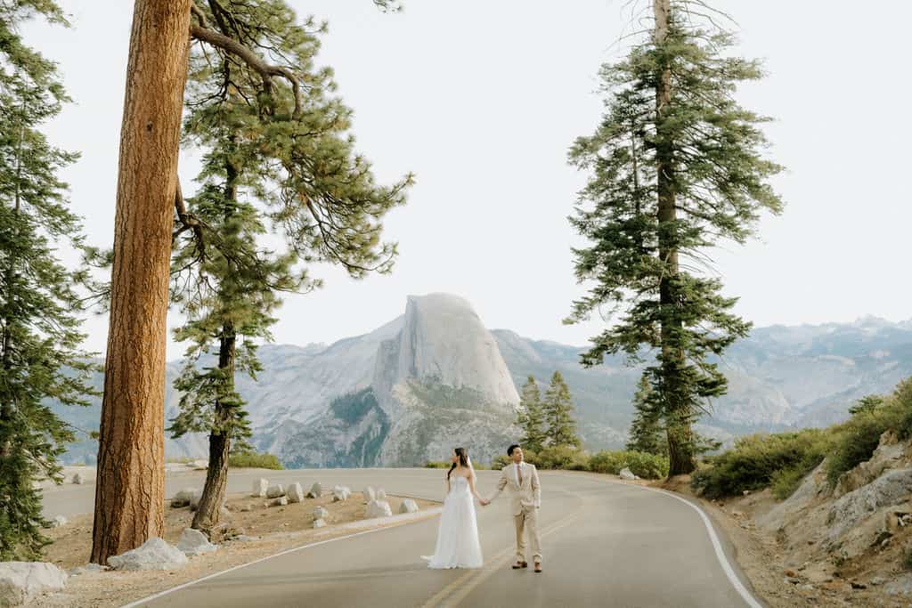 couple standing at glacier point on elopement morning