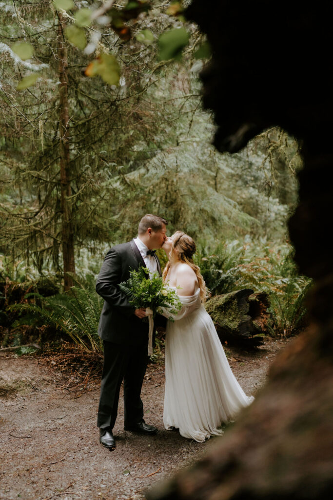 cute picture of the bride and groom kissing