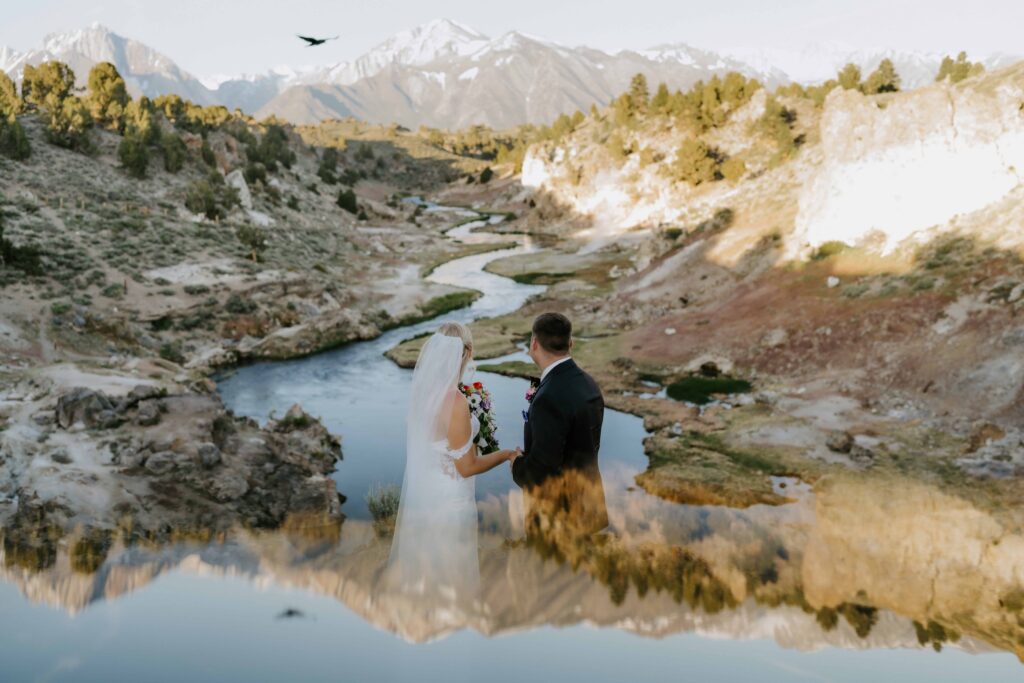 Mammoth lakes eloping couple at sunrise in front of the geothermal pools