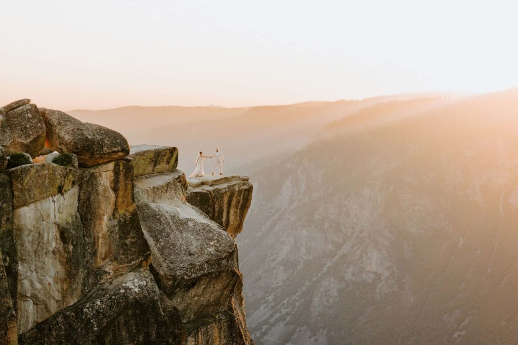 yosemite eloping couple at taft point for sunset and cotton candy skies