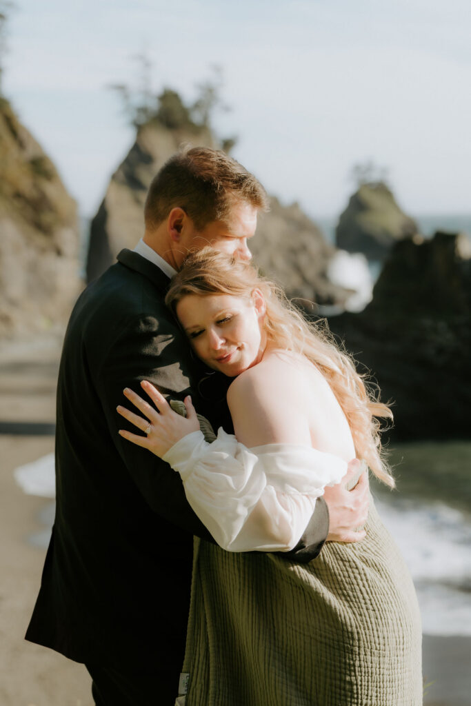 romantic picture of the newlyweds hugging
