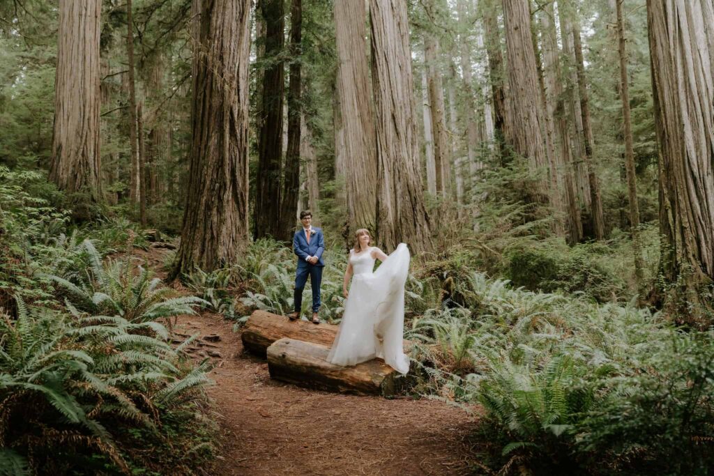 redwood eloping couple in jedediah smith redwoods after their ceremony posing among the trees