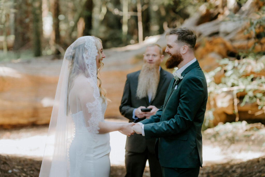 bride and groom holding hands during their ceremony
