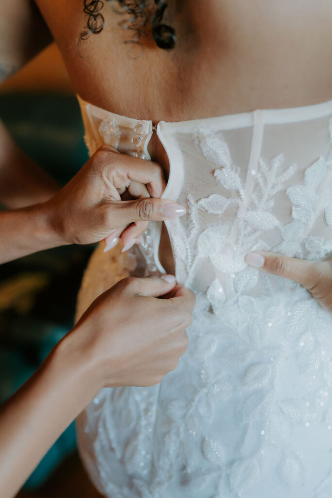 bride getting ready for her first look with the groom