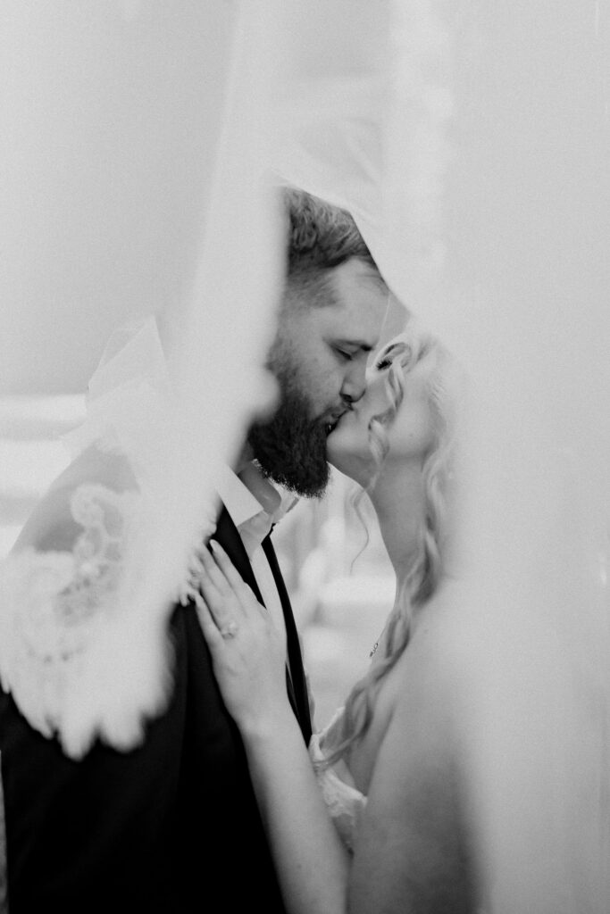 cute picture of the newly married couple kissing