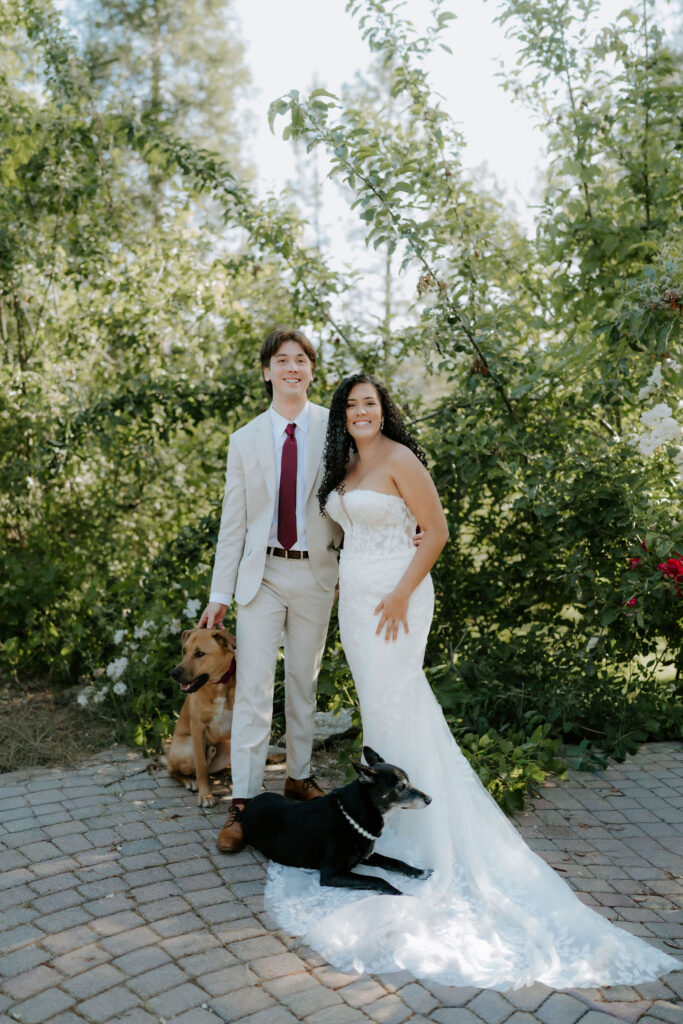 bride and groom smiling at the camera during their photoshoot