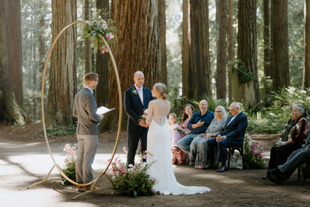 bride and groom holding hands during their wedding ceremony