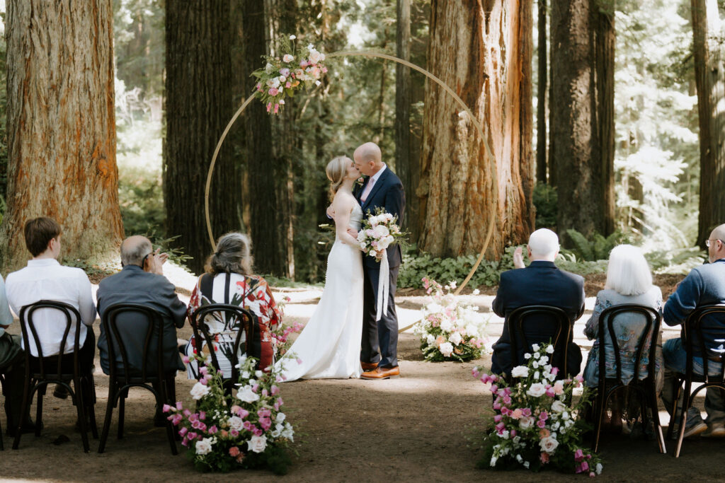 cute picture of the newlyweds kissing after their ceremony