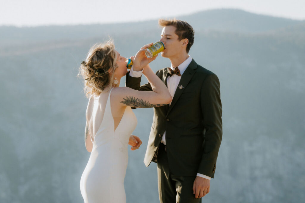 couple celebrating their elopement with champagne