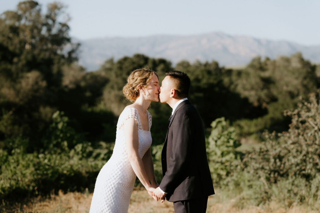romantic picture of the newlyweds kissing