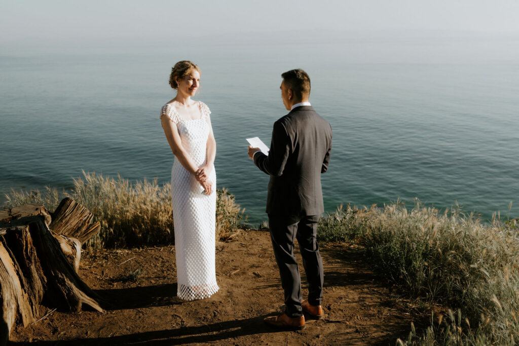 bride and groom reading their private vows