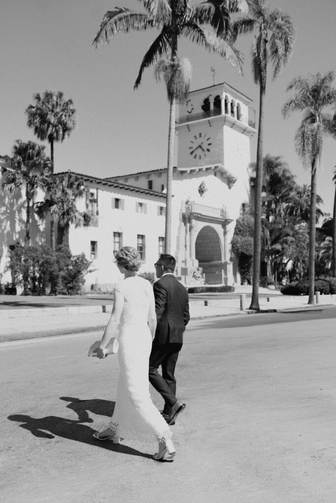 bride and groom heading to the courthouse