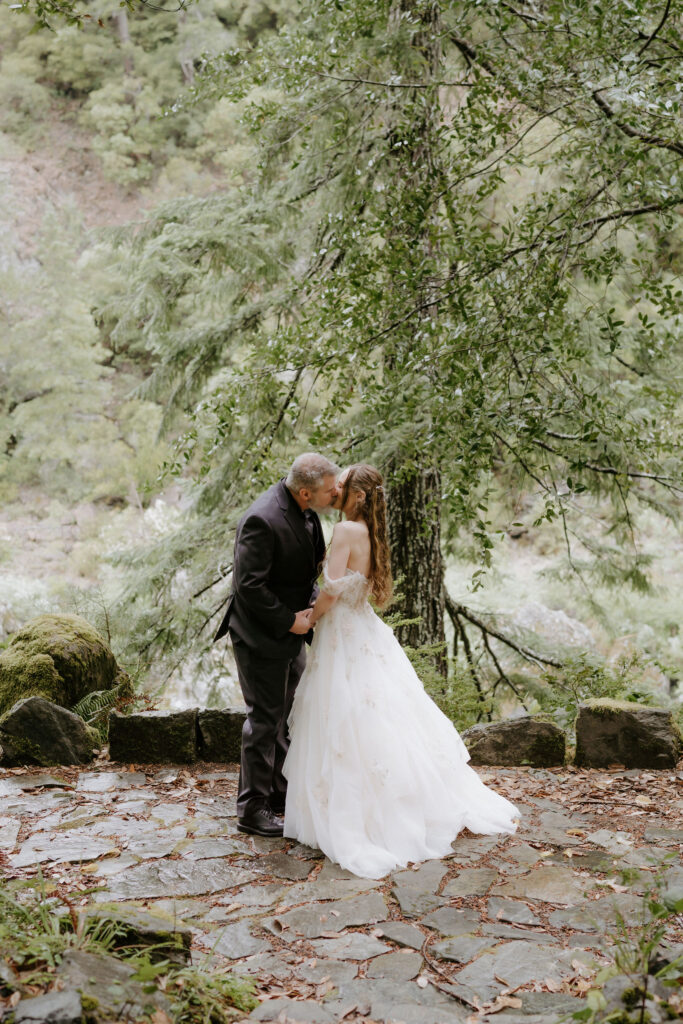 cute picture of the bride and groom kissing