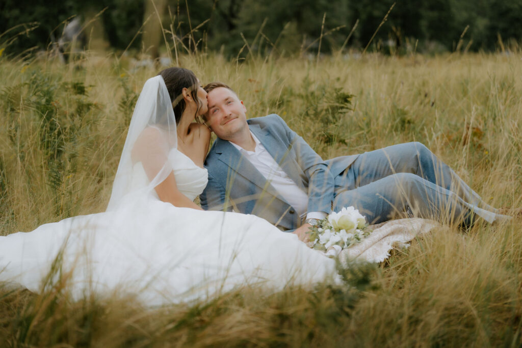 bride kissing the groom on the cheek