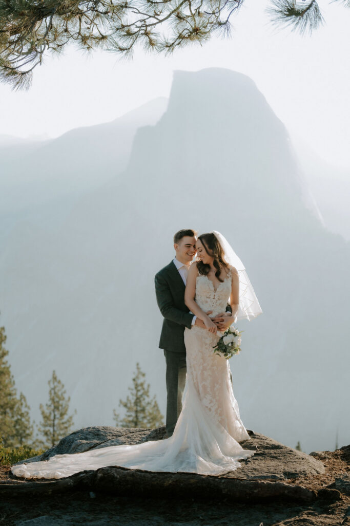 cute picture of the groom kissing the bride on the cheek