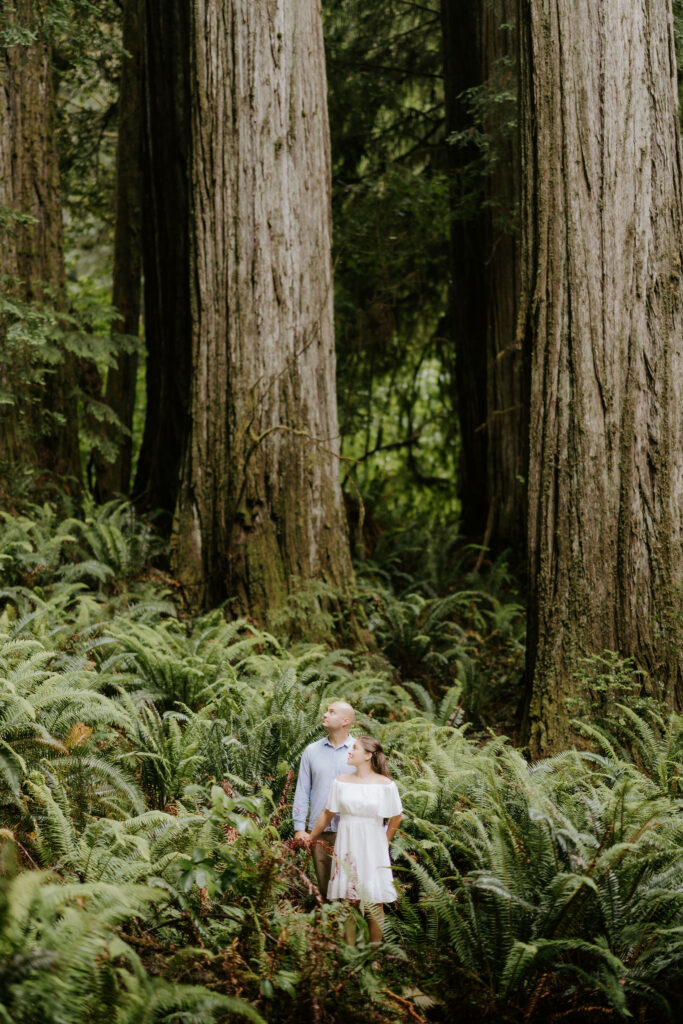 couple smiling at the camera during their photoshoot