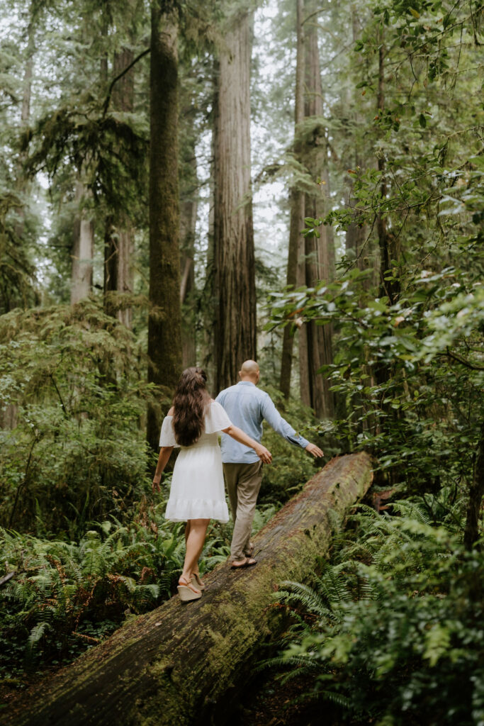 newly engaged couple smiling at each each other
