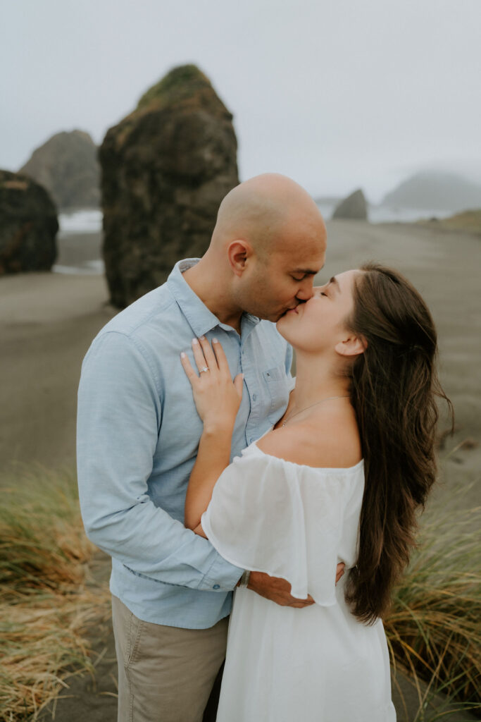 cute portrait of the newly engaged couple kissing
