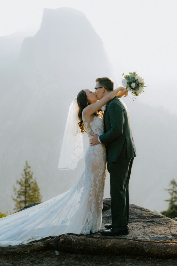 cute picture of the bride and groom kissing
