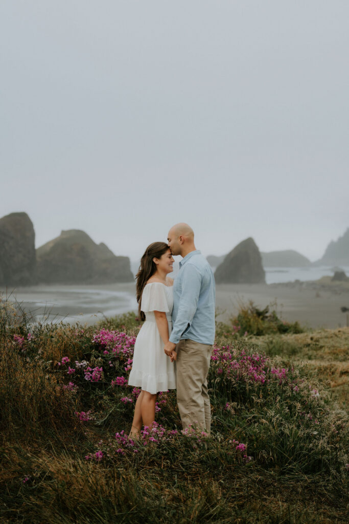 fiance kissing his fiance on the forehead
