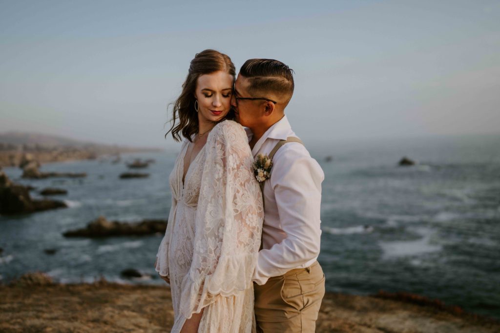 close up of couple eloping on california coast