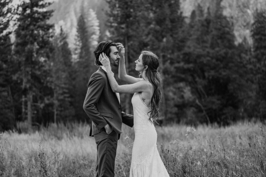 Black and white Couple getting ready during Yosemite elopement