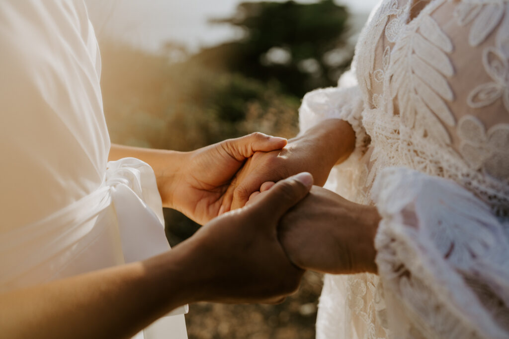 couple holding hands during ceremony