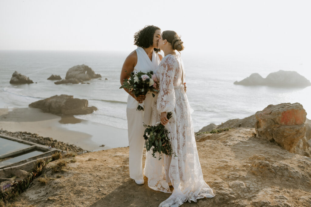 eloping couple kissing at sutro baths on their adventure elopement