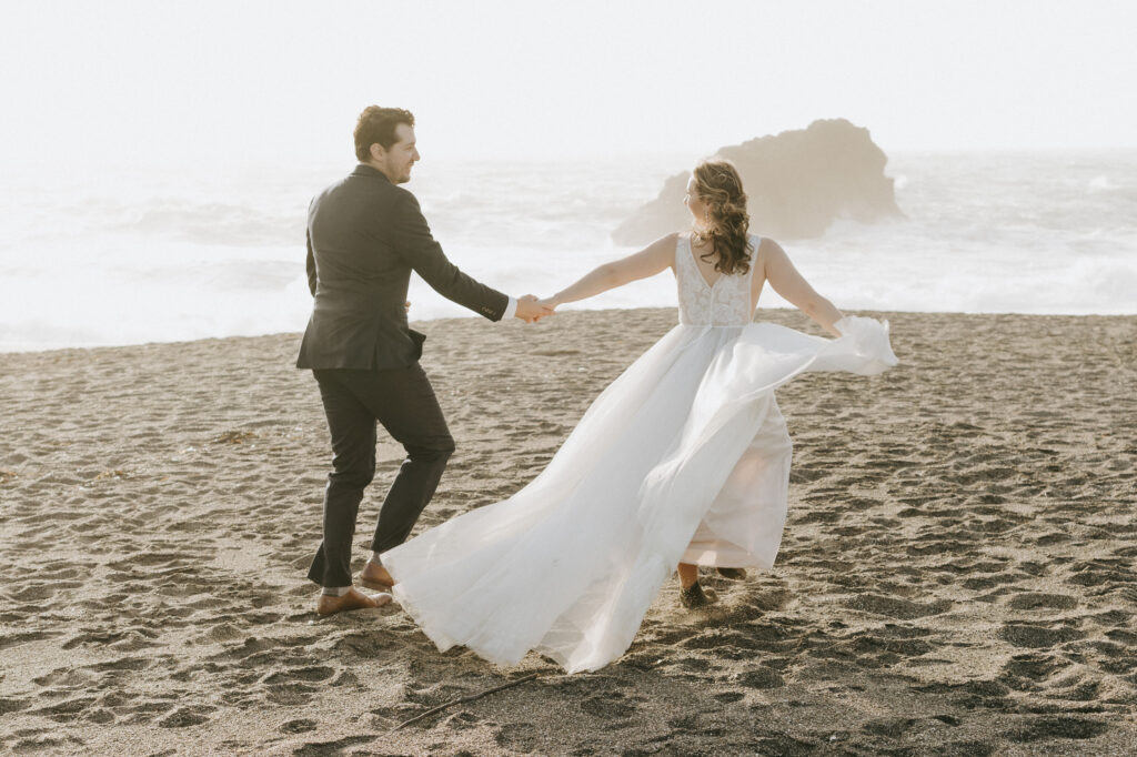 elopement couple on beach at sunset in mendocino california