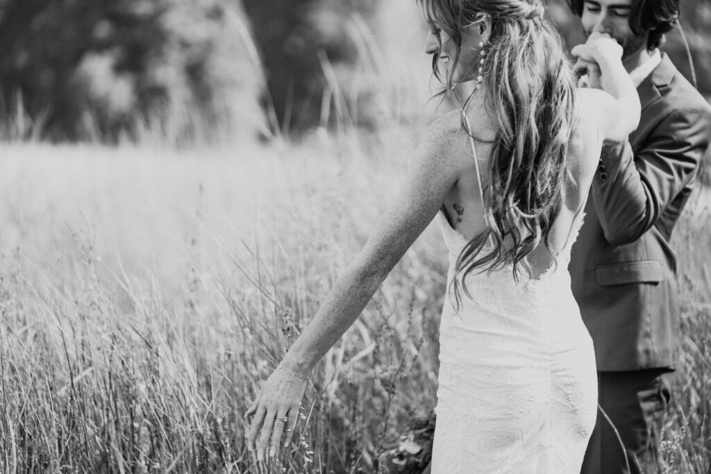 black and white couple walking through el capitan meadow on elopement day
