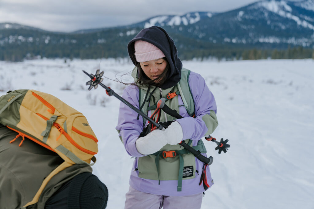Snowshoe adventure couple getting ready for Lake Tahoe proposal