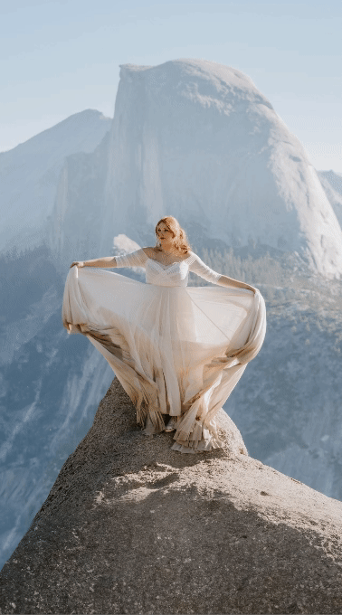 Adventure Bride at Glacier point sunrise playing with wedding dress